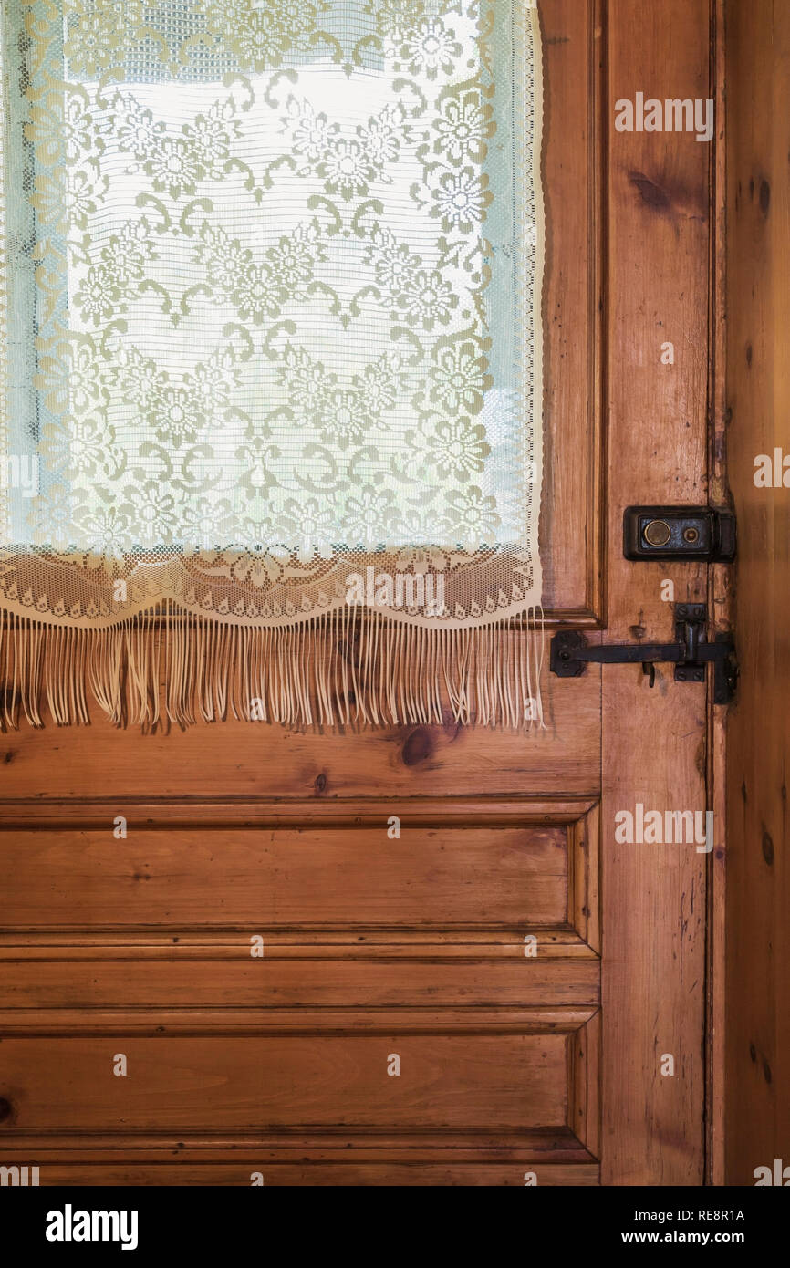 Old Curtain Hi Res Stock Photography And Images Alamy   Brown Stained Wooden Entrance Door In Living Room Inside An Old 1807 Canadiana Style Home RE8R1A 