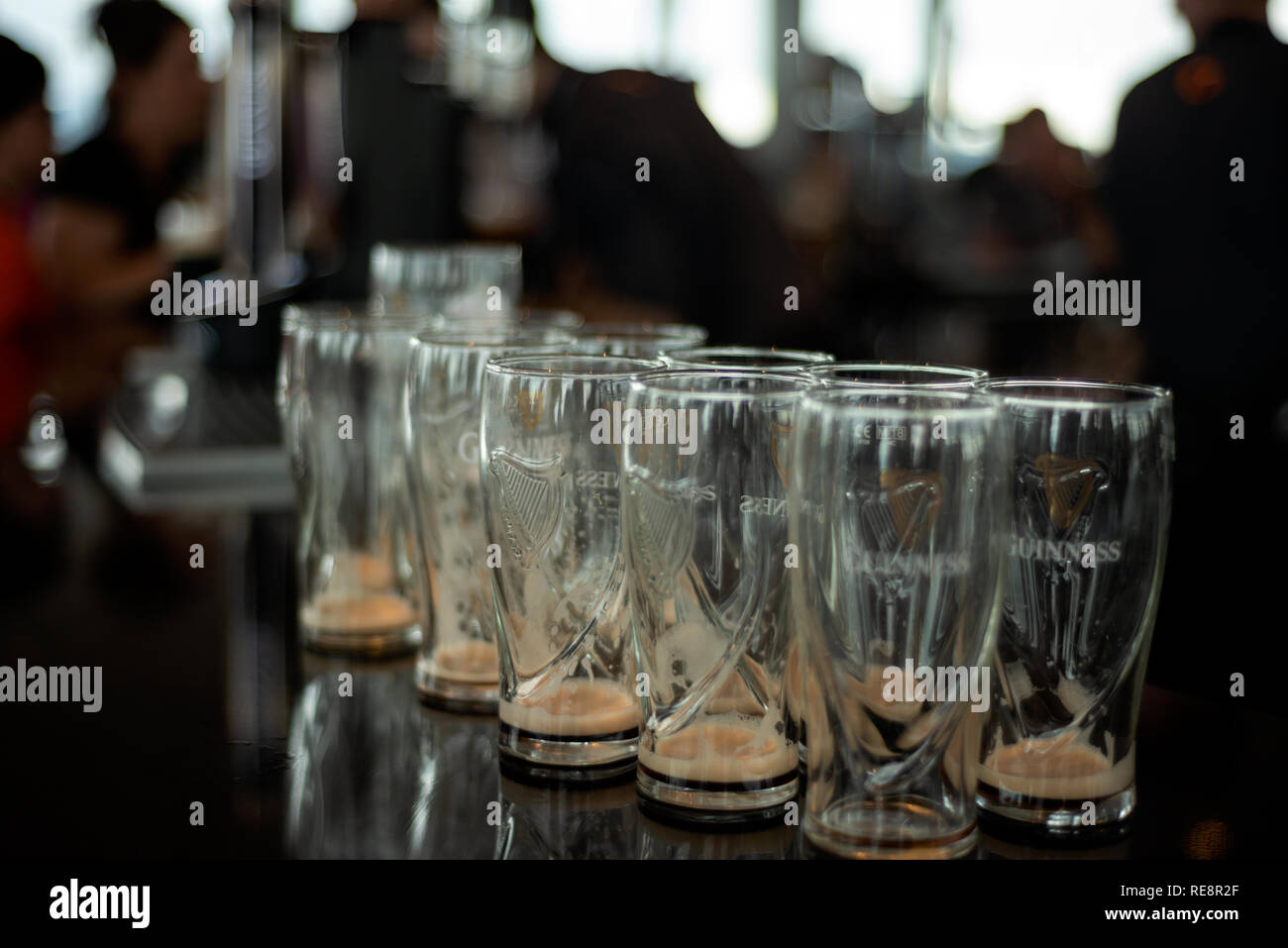 https://c8.alamy.com/comp/RE8R2F/empty-guinness-glasses-in-crowded-bar-and-people-in-background-in-the-gravity-bar-guinness-storehouse-dublin-ireland-RE8R2F.jpg