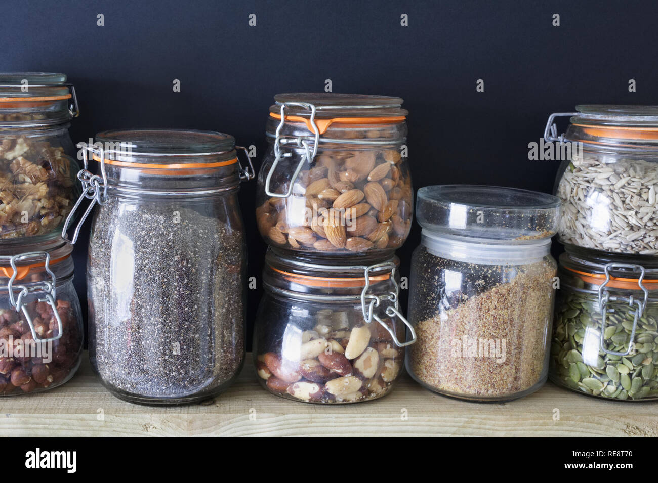 Nuts and seeds in glass jars Stock Photo Alamy