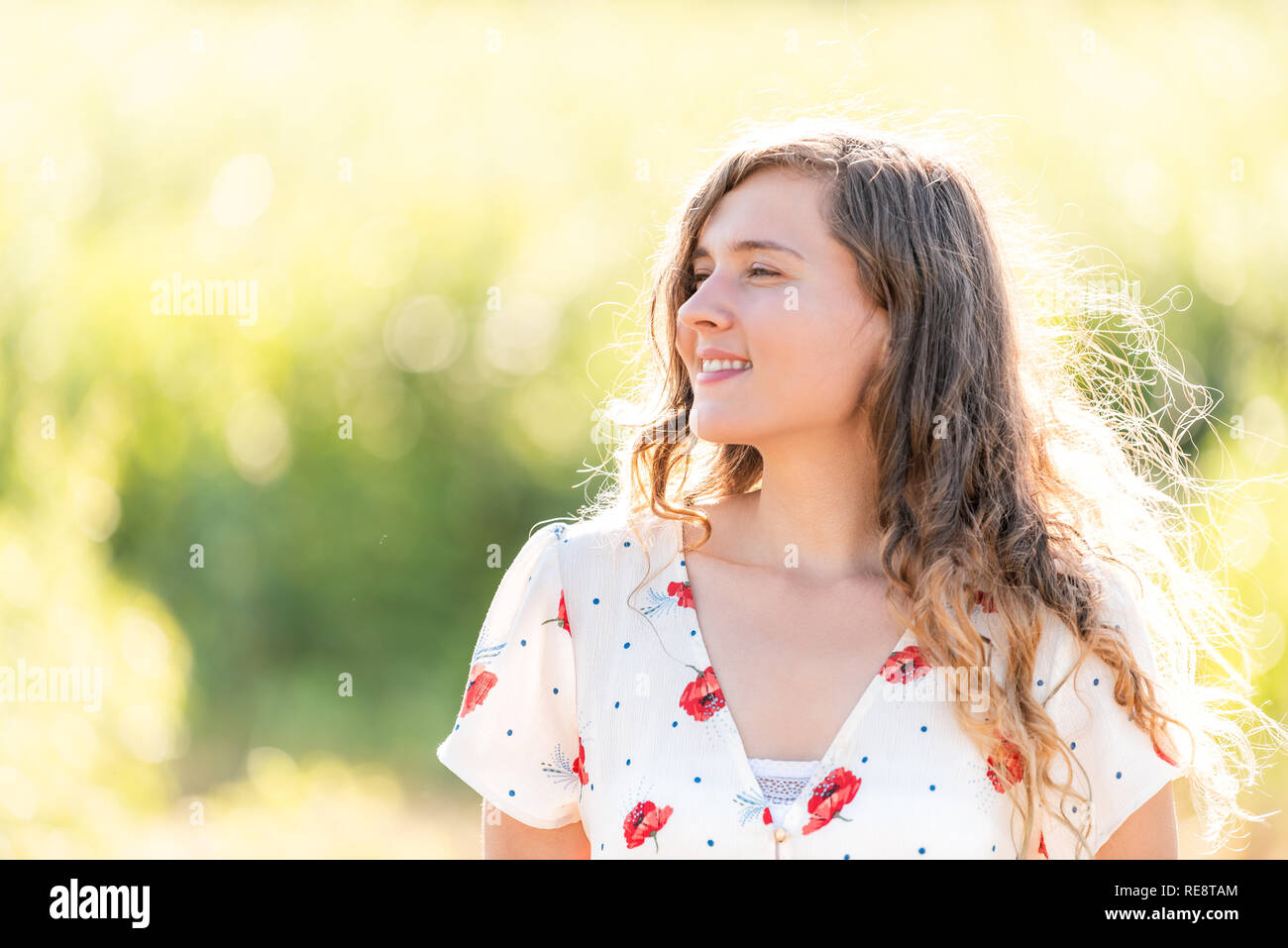 Portrait smiling young woman backlight hi-res stock photography and ...