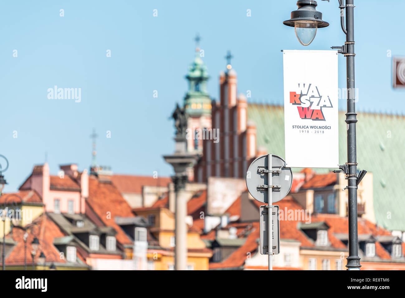 Warsaw, Poland - August 23, 2018: Famous old town Castle Square tower in capital city during sunny summer day cityscape and closeup of sign for Warsza Stock Photo