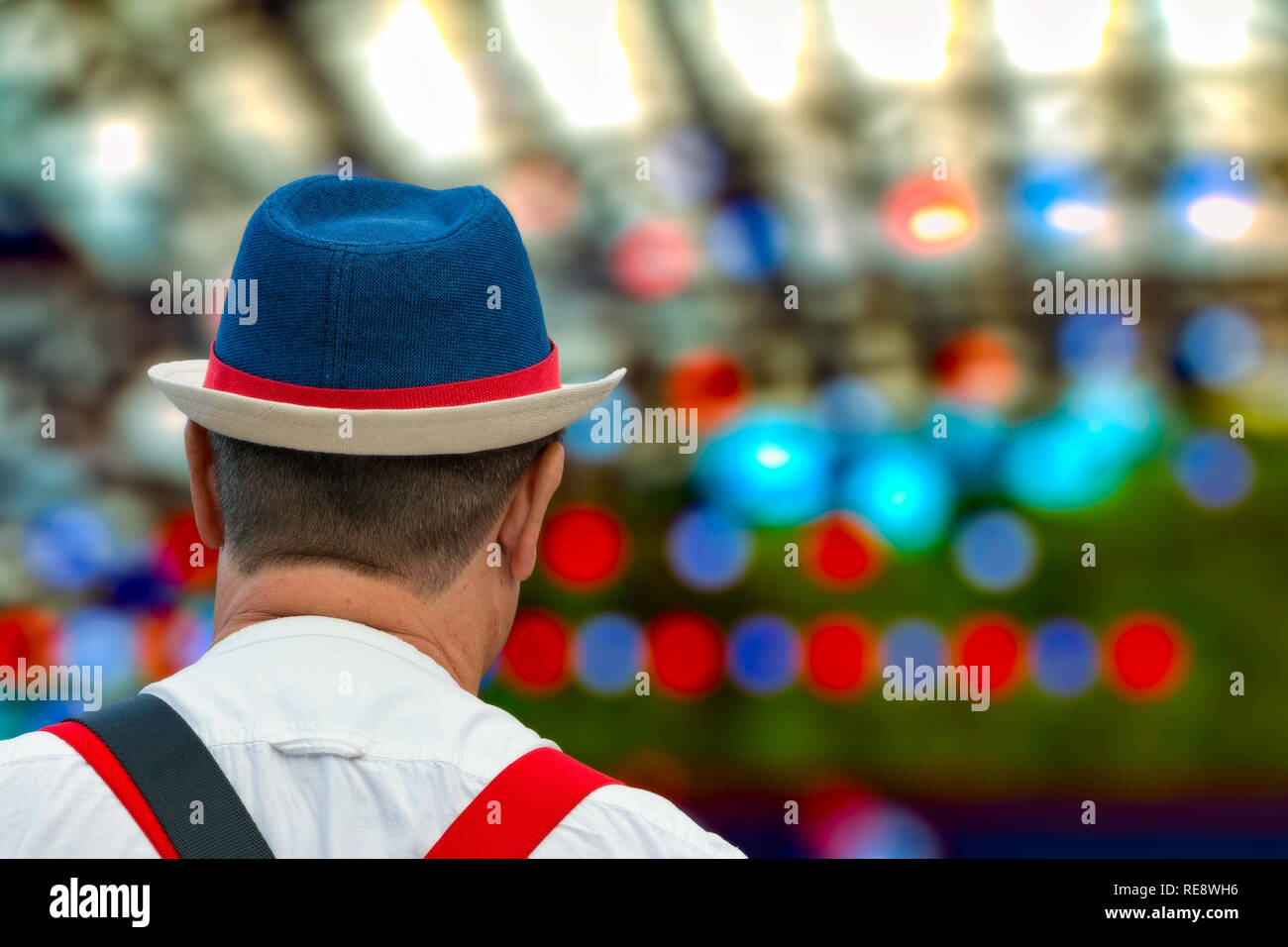 man in blue hat at outdoor music festival Stock Photo