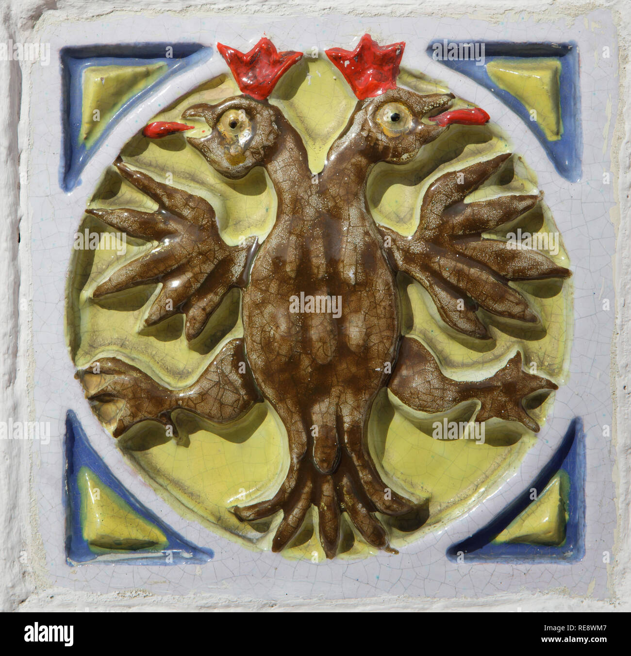 Russian double-headed eagle depicted in the glazed tile placed on the fence of the Church of Elijah the Prophet in Yaroslavl, Russia. Stock Photo