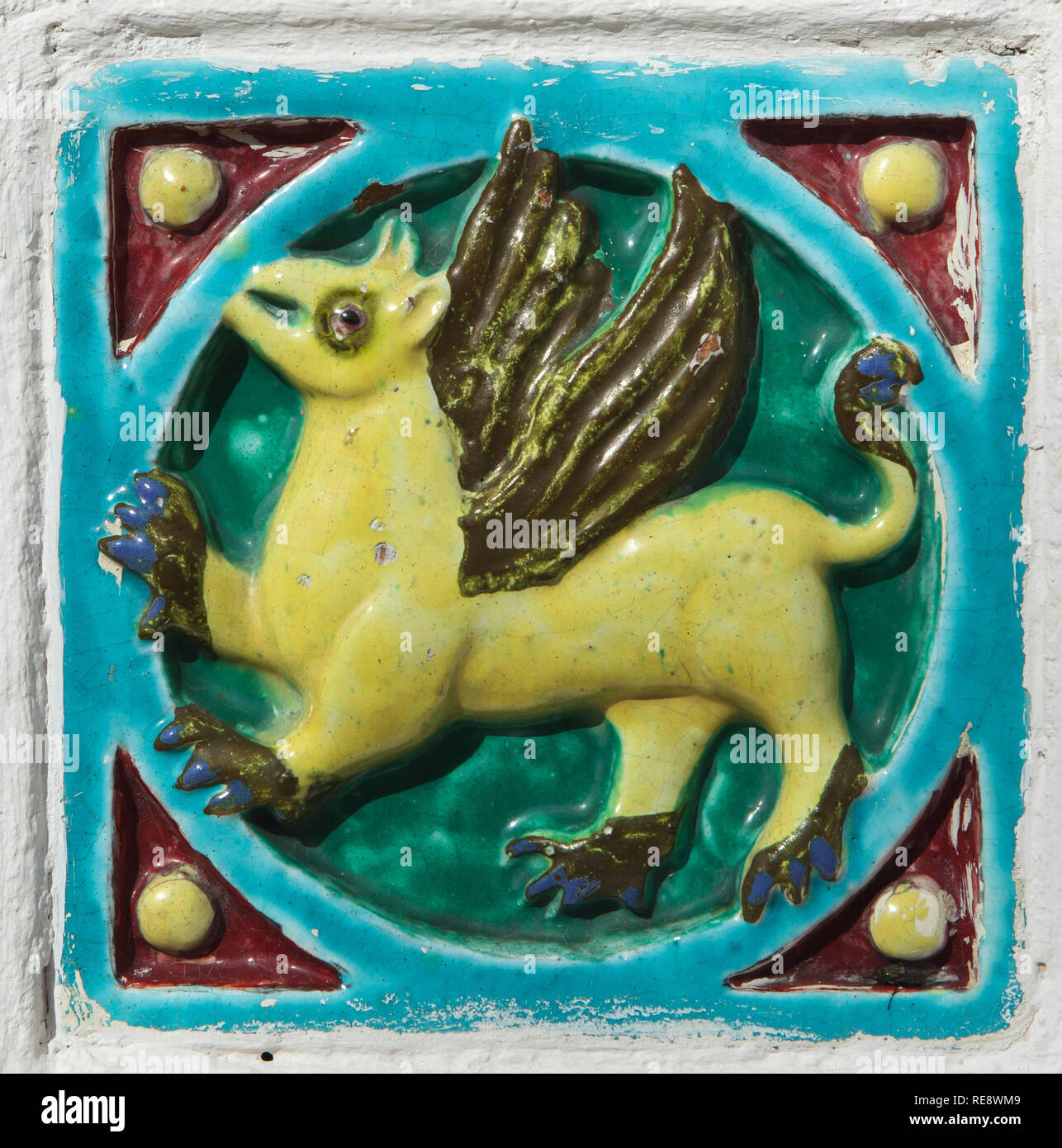 Griffin depicted in the glazed tile placed on the fence of the Church of Elijah the Prophet in Yaroslavl, Russia. Stock Photo