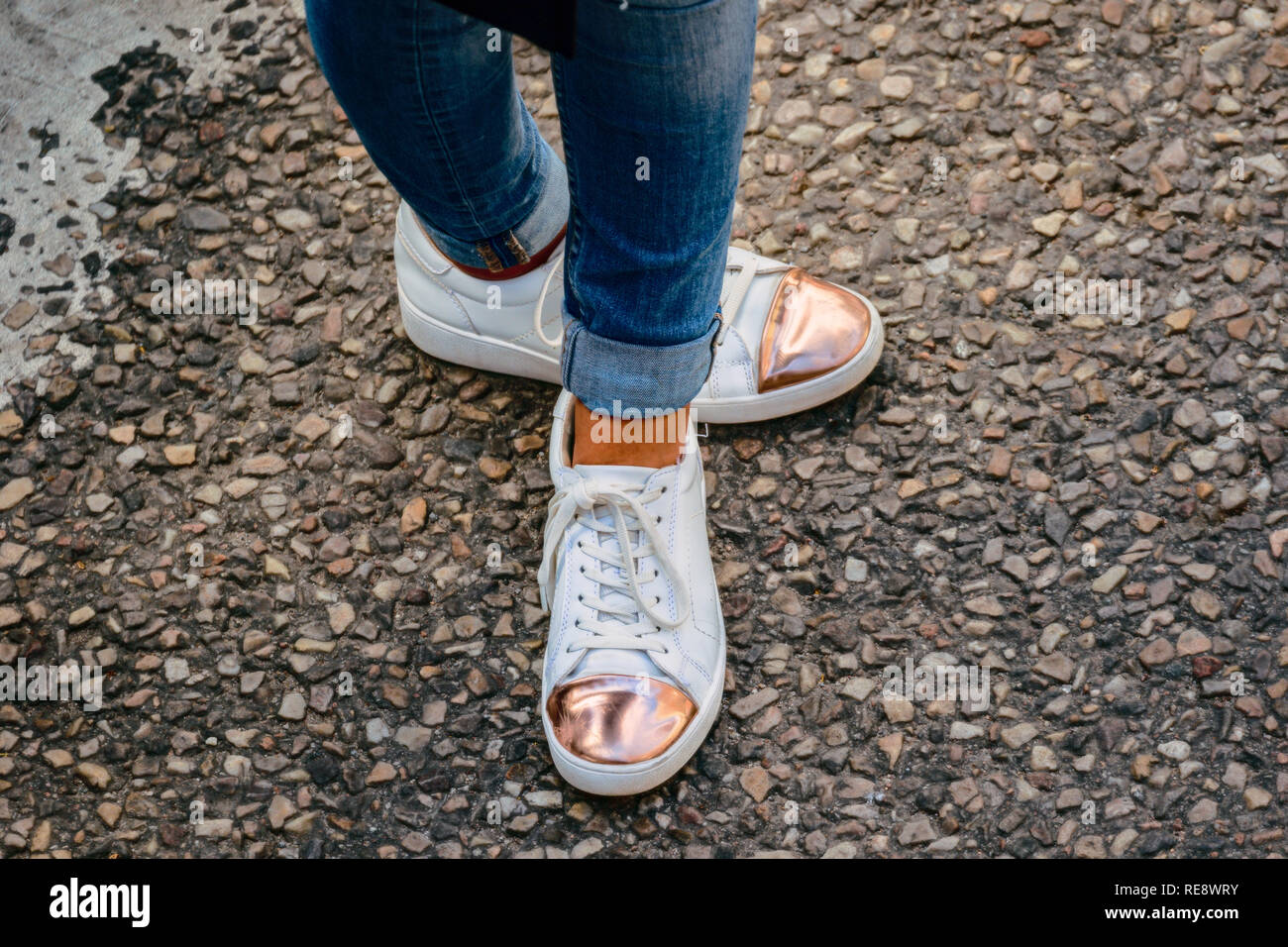 woman in summer shoes in white and pink Stock Photo