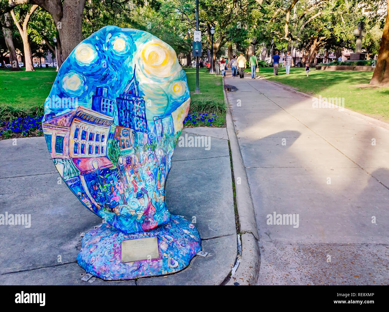 A painted, fiberglass oyster stands on the corner of Bienville Square