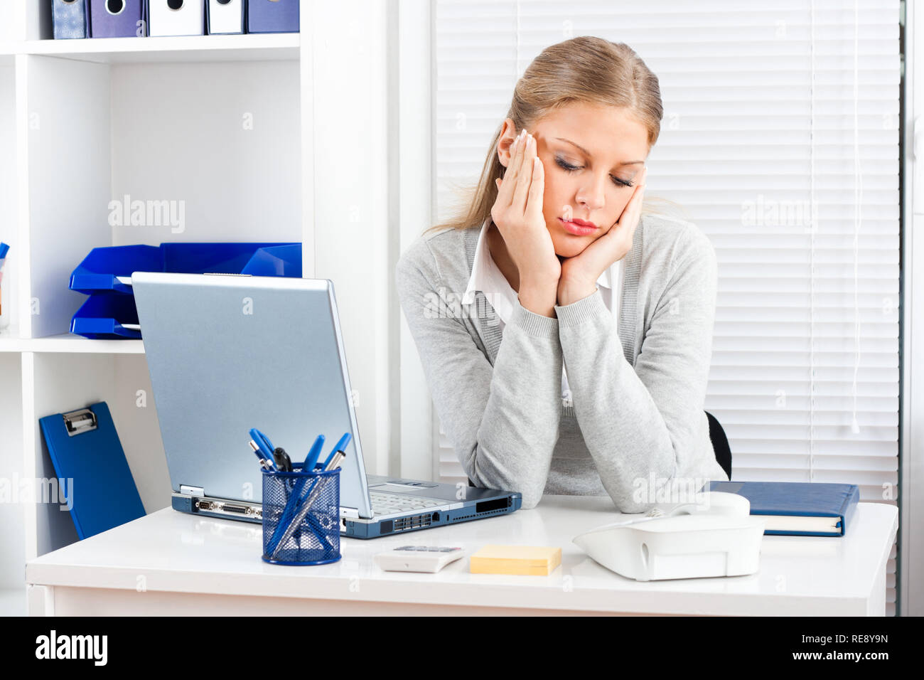Tired businesswoman Stock Photo