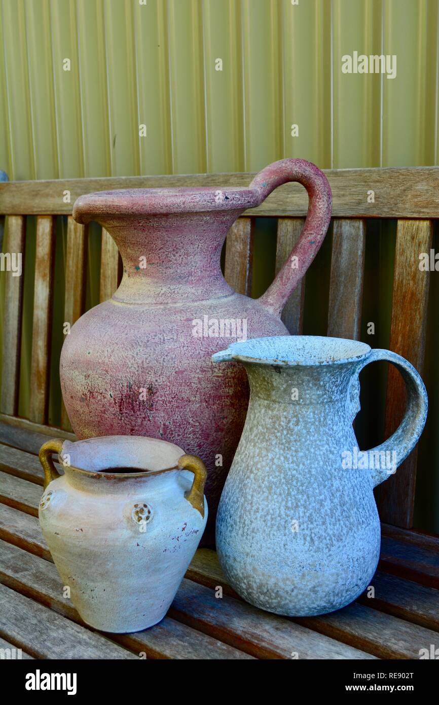 Antique and collectable items to decorate home; shabby chic of the old times. Colourful pots. Stock Photo
