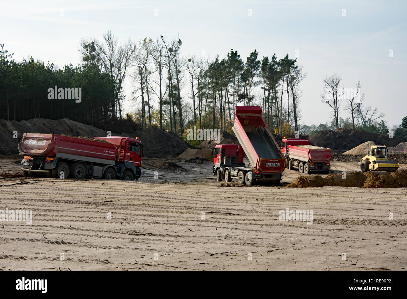 KRUSZYN KRAJENSKI, SZKOCJA, KUJAWSKO-POMORSKIE/POLAND - NOVEMBER 4, 2017 - S5 construction site with three man kipper dumpers bringing sand on the roa Stock Photo
