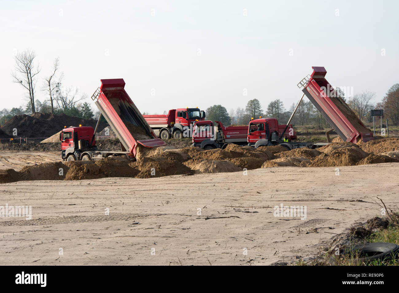 KRUSZYN KRAJENSKI, SZKOCJA, KUJAWSKO-POMORSKIE/POLAND - NOVEMBER 4, 2017 - S5 construction site with four man kipper dumpers bringing sand on the road Stock Photo
