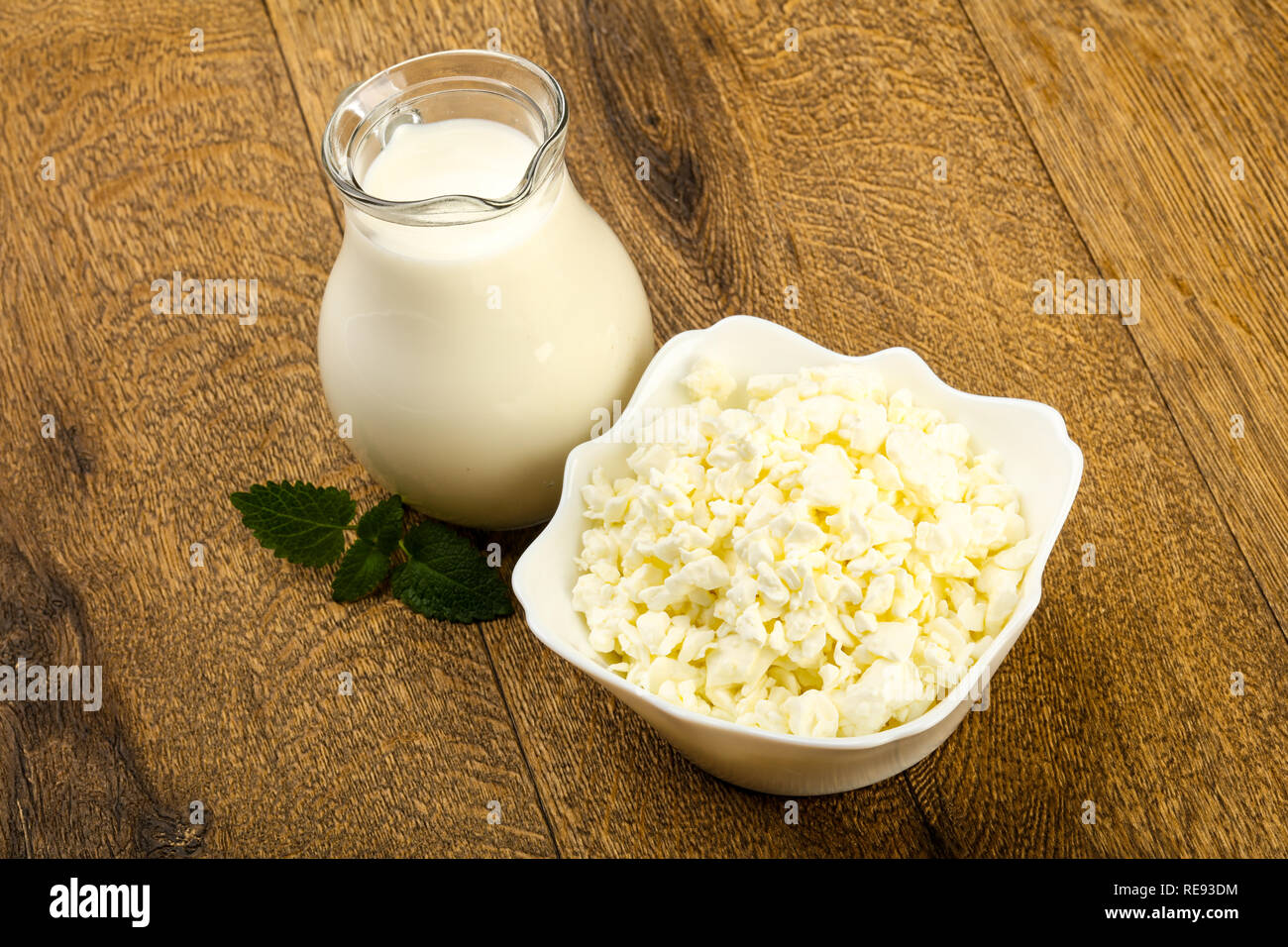 Cottage Cheese In The Bowl With Milk Stock Photo 232540272 Alamy