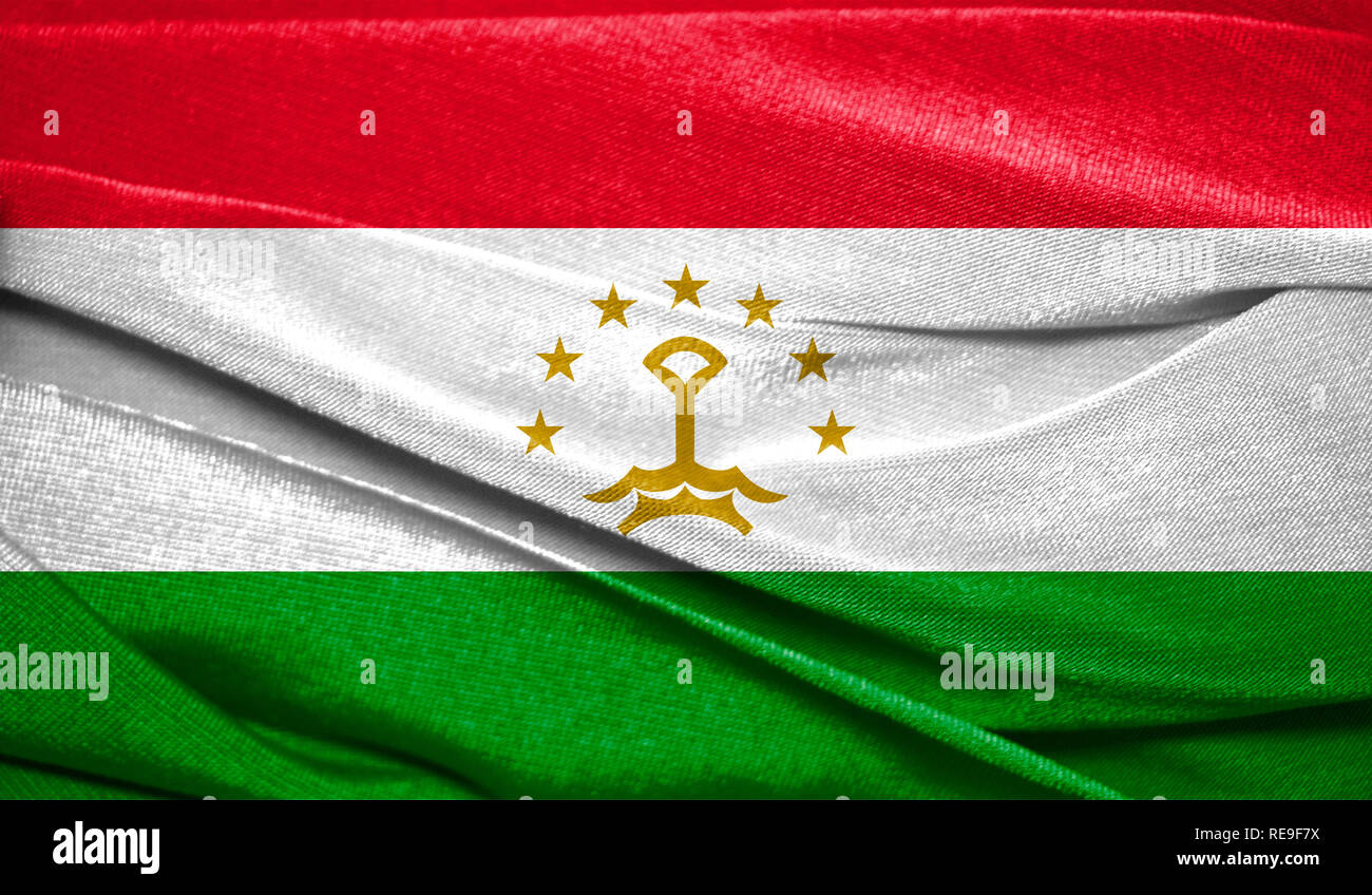 Realistic flag of Tajikistan on the wavy surface of fabric. Perfect for background or texture purposes. Stock Photo