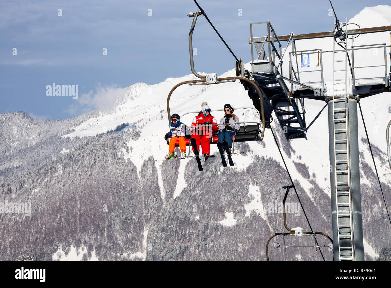 The Mouilles Chairlift Transporting Skiers up the Ski Slopes to the Le Pleney Gondola Area in Mountains above Morzine Ski Resort Haute Savoie France Stock Photo
