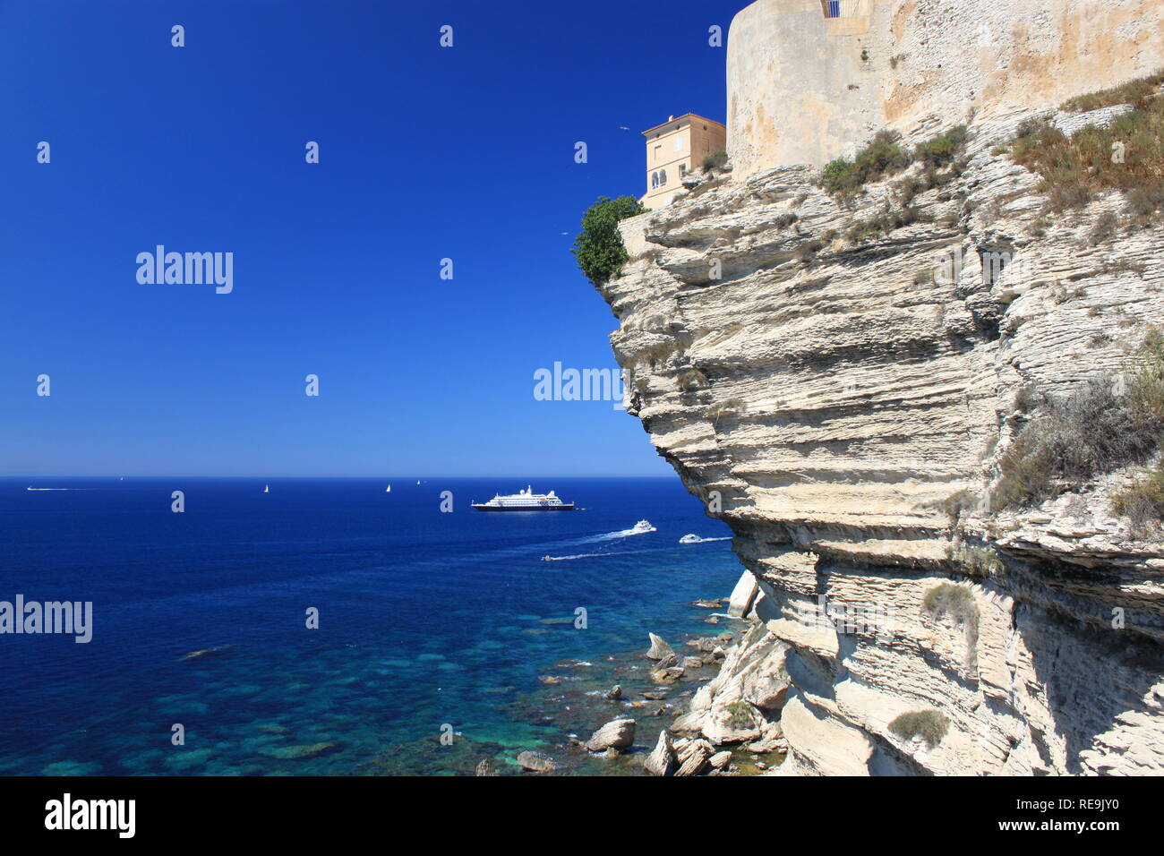 Impressive house on cliff edges in Bonifacio town, Corsica, France Stock Photo