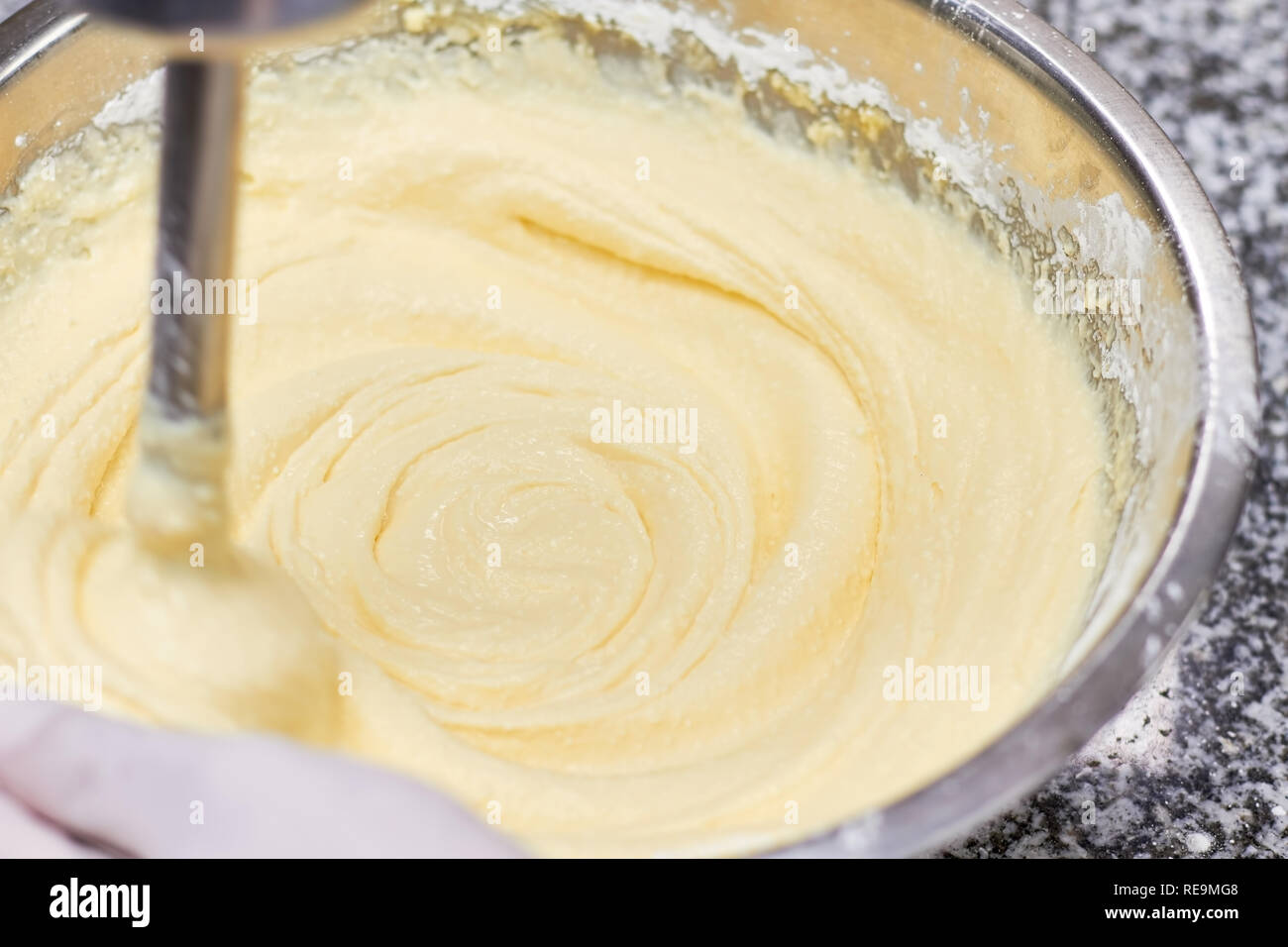 Mixing of creamy dough. Mixing dough in bowl with mixer. Baking cake