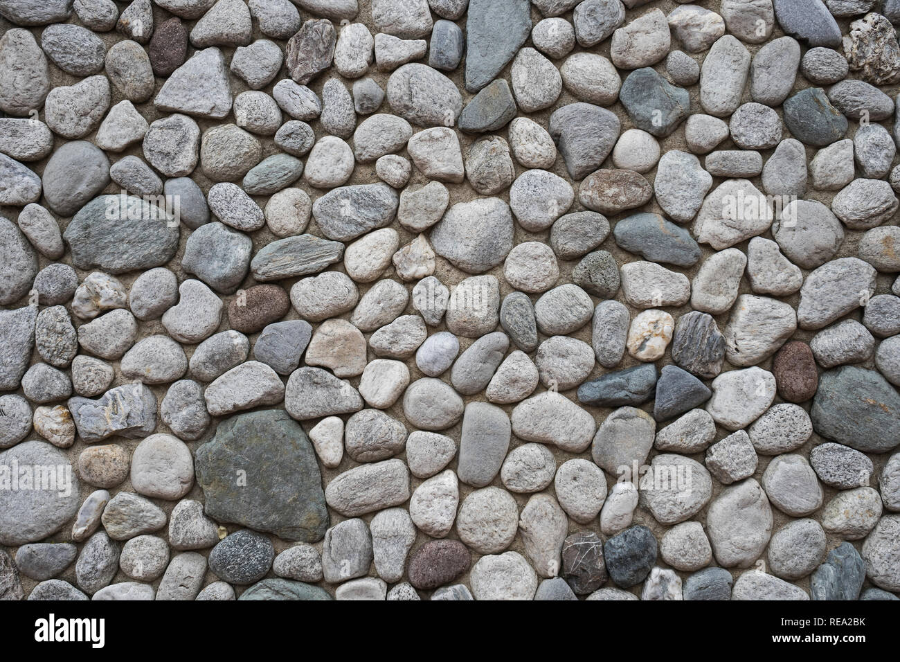 wall made of pebbles Stock Photo