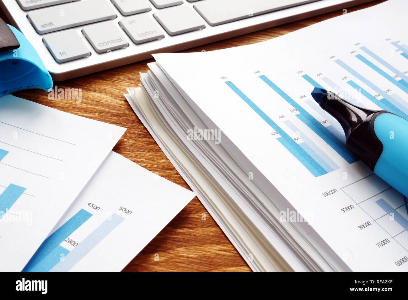 Pile of business documents on desk. Financial papers in the office. Stock Photo