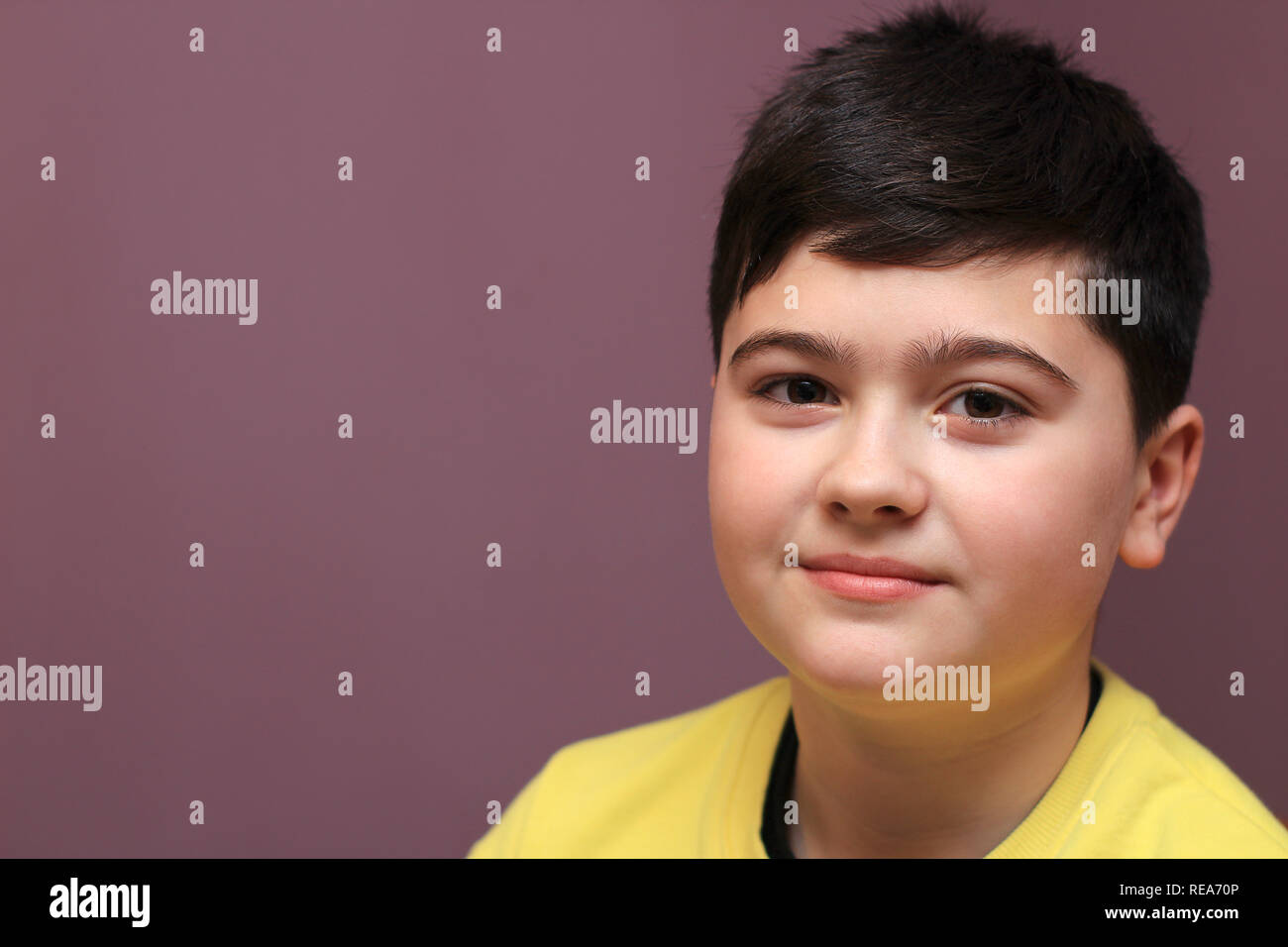 Little cute brown haired boy looking hi-res stock photography and ...