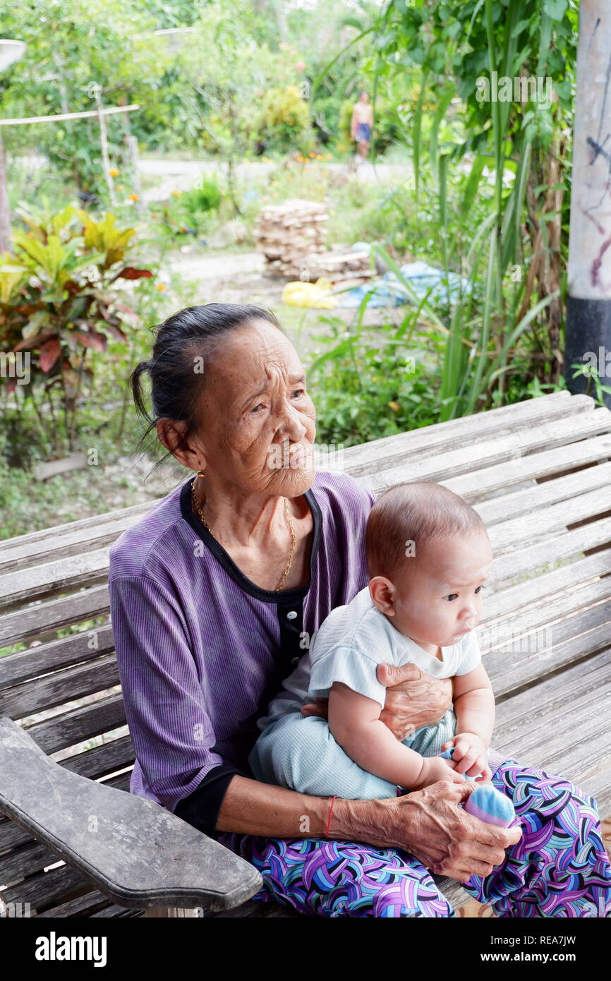 indonesian great grandma and great grandson Stock Photo
