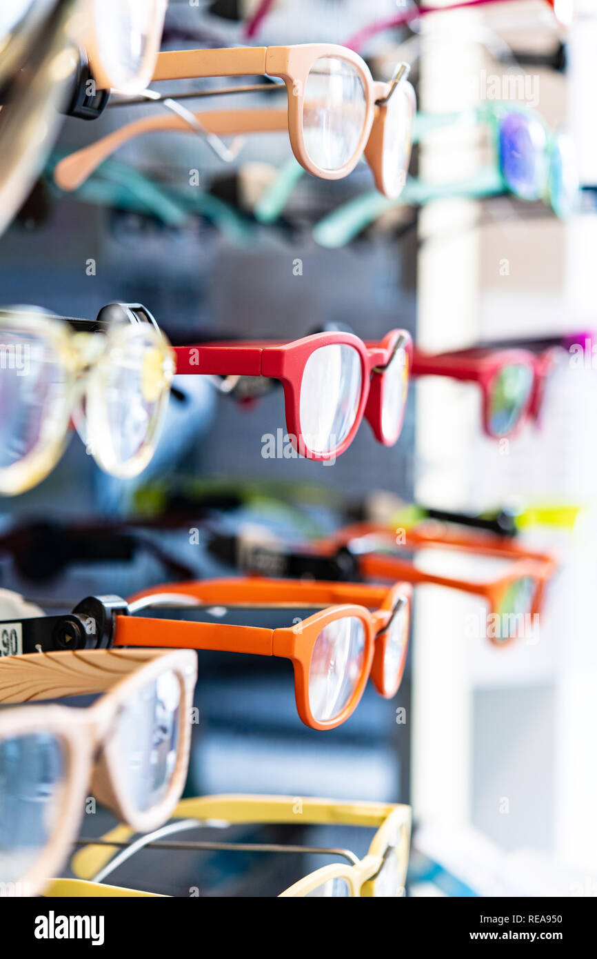 Close up of eyeglasses for sale hanging in shop window, selective focus Stock Photo