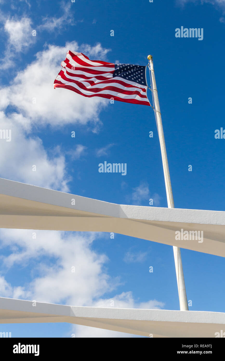 Stand Tall - The Stars and Stripes proudly waves over the USS Arizona Memorial. Pearl Harbor, Oahu, Hawaii, USA Stock Photo