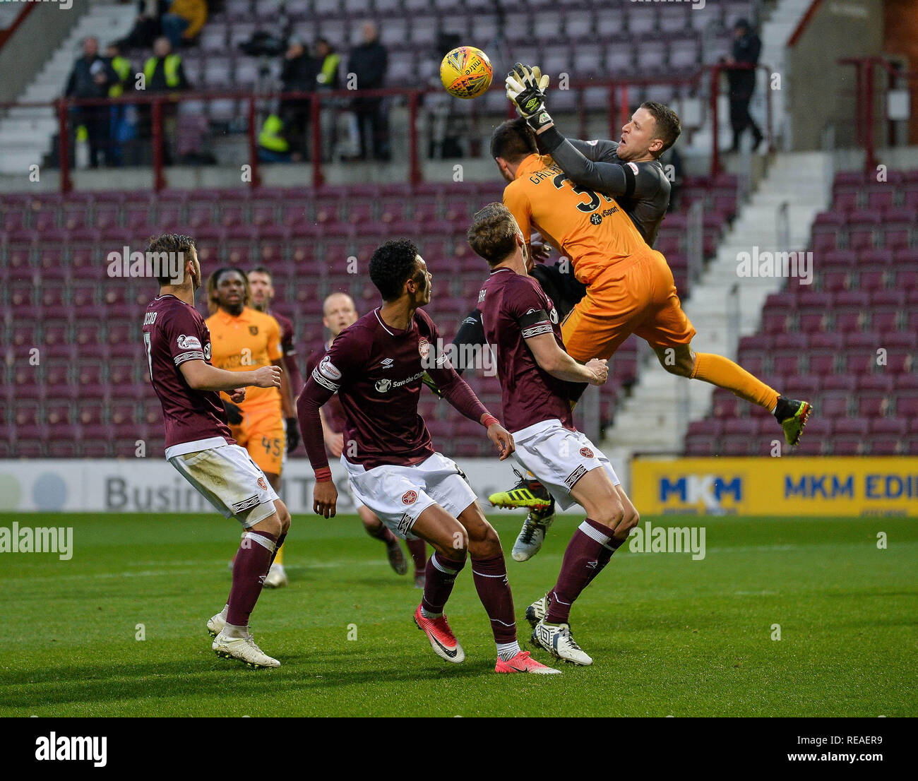 Edinburgh, Scotland, UK. 20th January, 2019.   Heart of Midlothian took on Premiership rivals Livingston in the fourth round of the William Hill Scottish Cup tie at Tynecastle today. The Edinburgh side came out on top thanks to a second half strike from Sean Clare. They now face heroes of the round junior side Auchinleck Talbot.  Pictured: Declan Gallagher (Livingston) sees his shot saved by Hearts goalkeeper Colin Doyle during the William Hill Scottish Cup fourth round match between Premiership rivals Hearts and Livingston at Tynecastle.  Dave Johnston / Alamy Live News Stock Photo