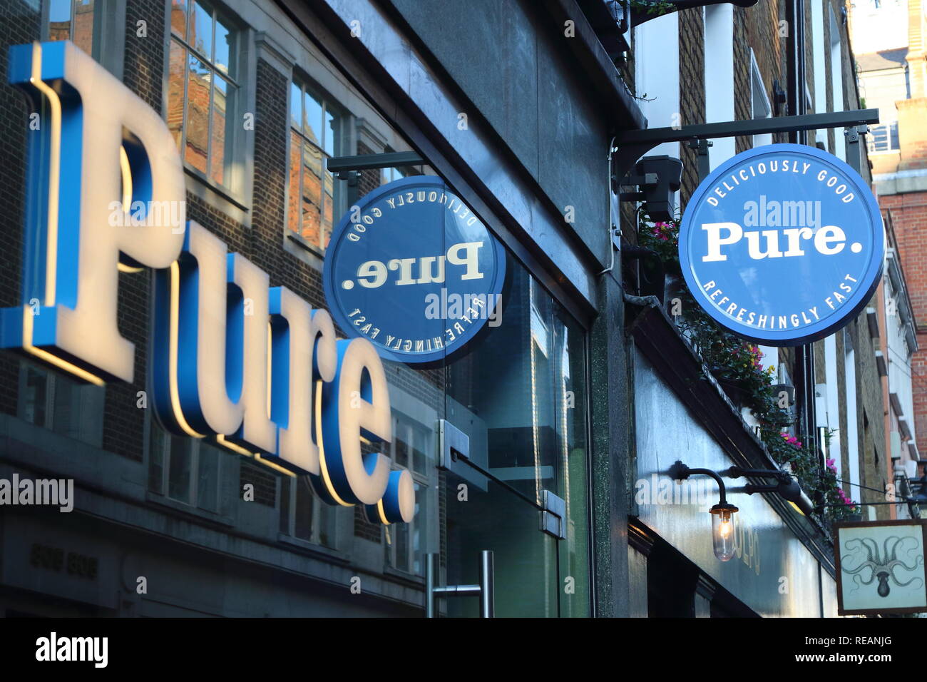 Pure brand logo seen in Carnaby Street in London, UK. Stock Photo