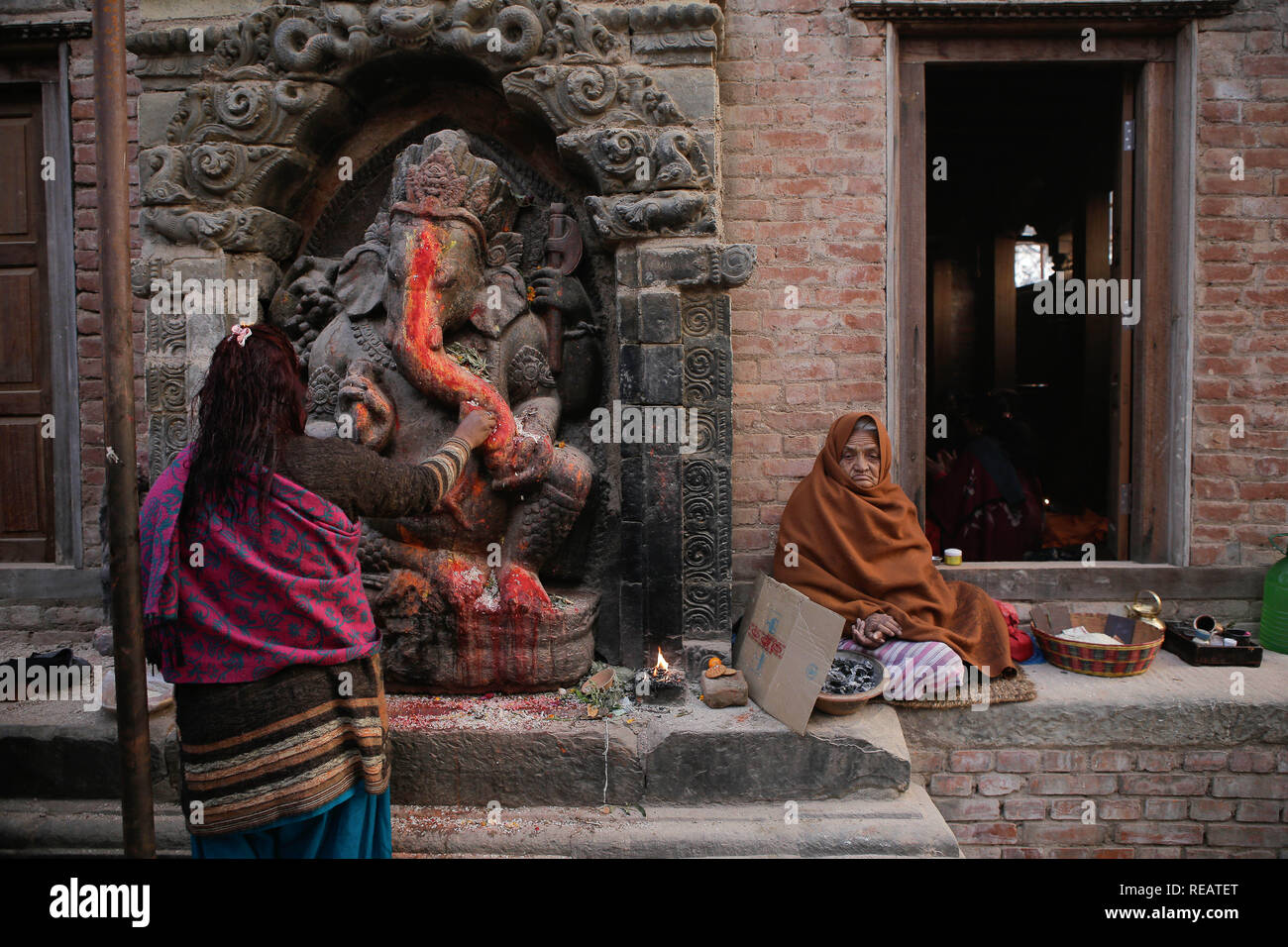 Bhaktapur, Nepal. 21st Jan, 2019. A devotee offers prayer during the Swasthani Brata Katha festival also called Madhav Narayan festival. The month-long festival is to observe fast and pray to Goddess Swasthani and God Madhav Narayan in the hope of a prosperous life and conjugal happiness of their families. Credit: Sunil Pradhan/SOPA Images/ZUMA Wire/Alamy Live News Stock Photo