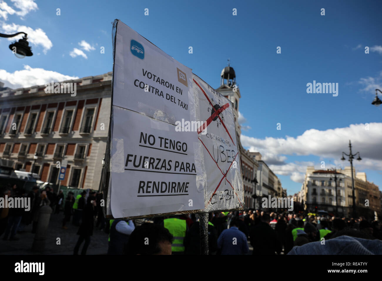 Madrid, Spain. 21st January, 2019. Demonstrators with placards protesting the conditions of the taxi at Puerta del Sol. The taxi drivers from Madrid, who have started a strike on Monday, have announced that they maintain the indefinite strike after reaching no pre-agreement with the president of the Community of Madrid Credit: Jesús Hellin/Alamy Live News Stock Photo