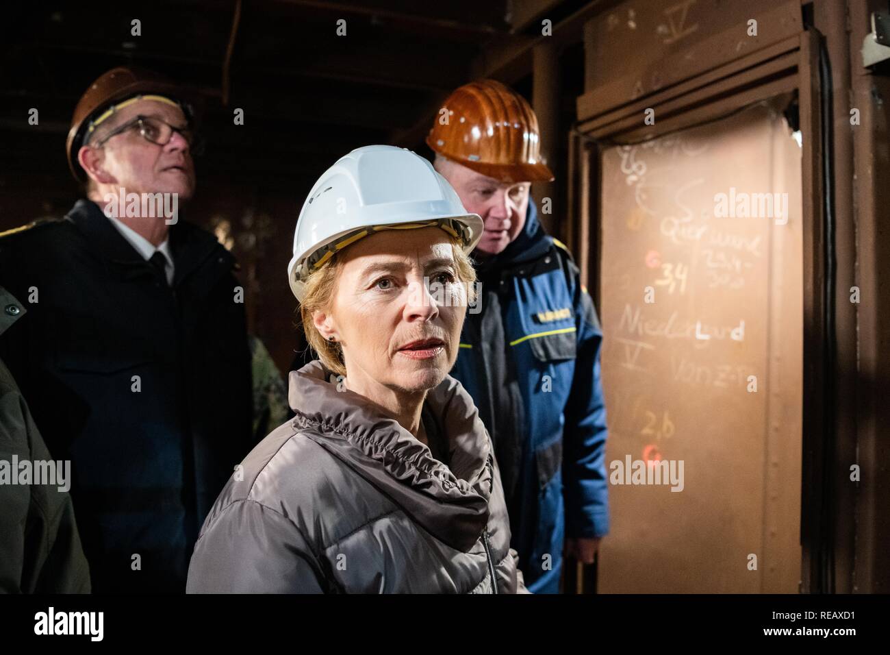 Bremerhaven, Germany. 21st Jan, 2019. Federal Defence Minister Ursula von der Leyen (CDU) is led through the ship by Nils Brandt (r), commander of the Gorch Fock. During her visit, the Minister informed herself about the status of the repair work and spoke with crew members. Von der Leyen wants to decide within a few weeks on the future of the ailing sailing training ship. Credit: Mohssen Assanimoghaddam/dpa/Alamy Live News Stock Photo