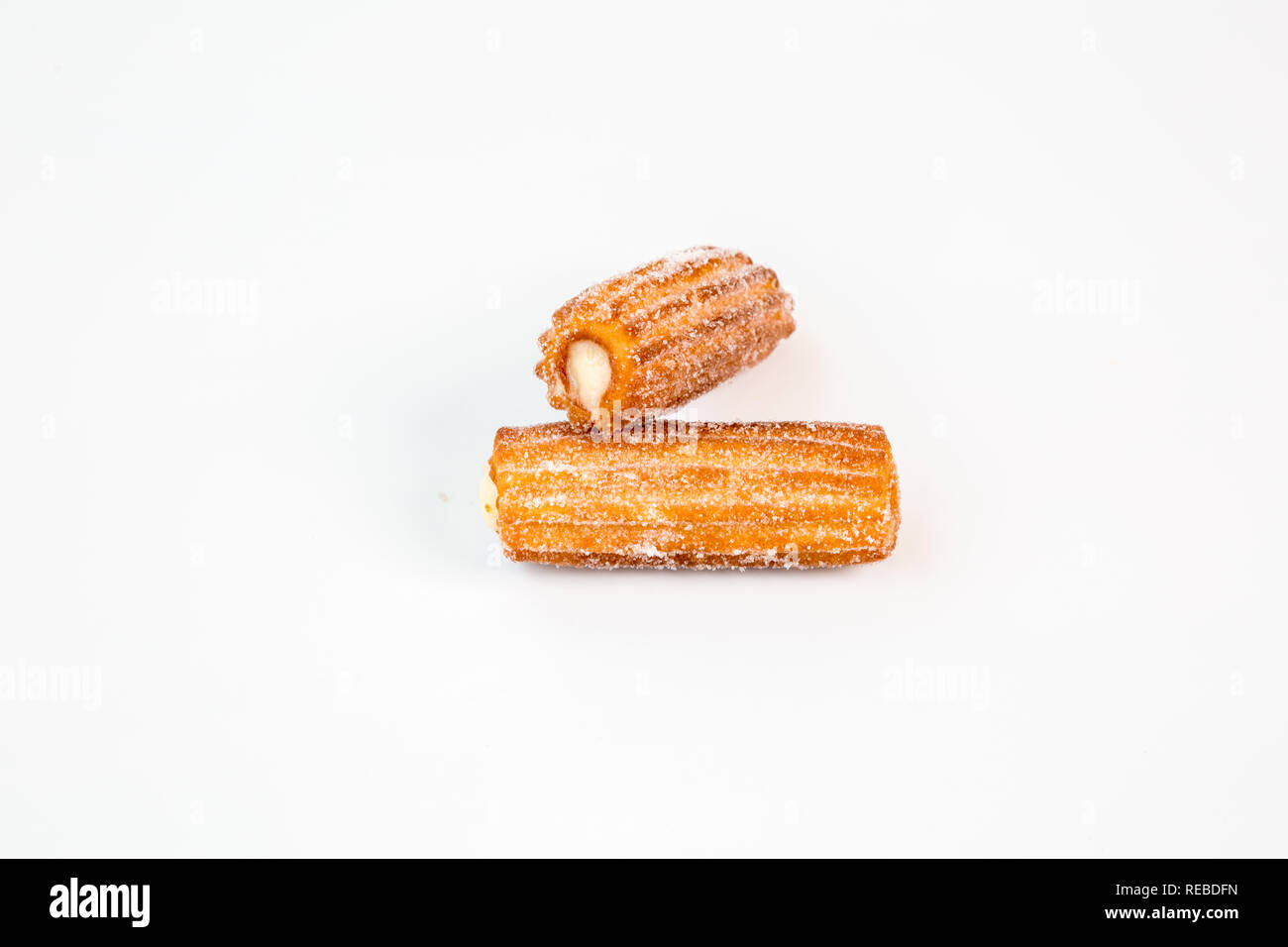 two sweet cream stuffed fritter churros with white background Stock Photo
