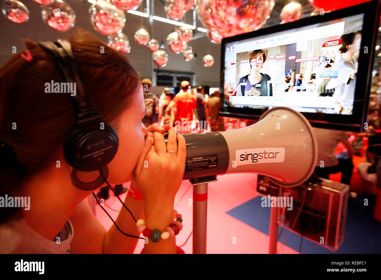 Sony PlayStation Singstar karaoke singing game, stand at the Entertainment Area of the Gamescom, the world's largest fair for Stock Photo