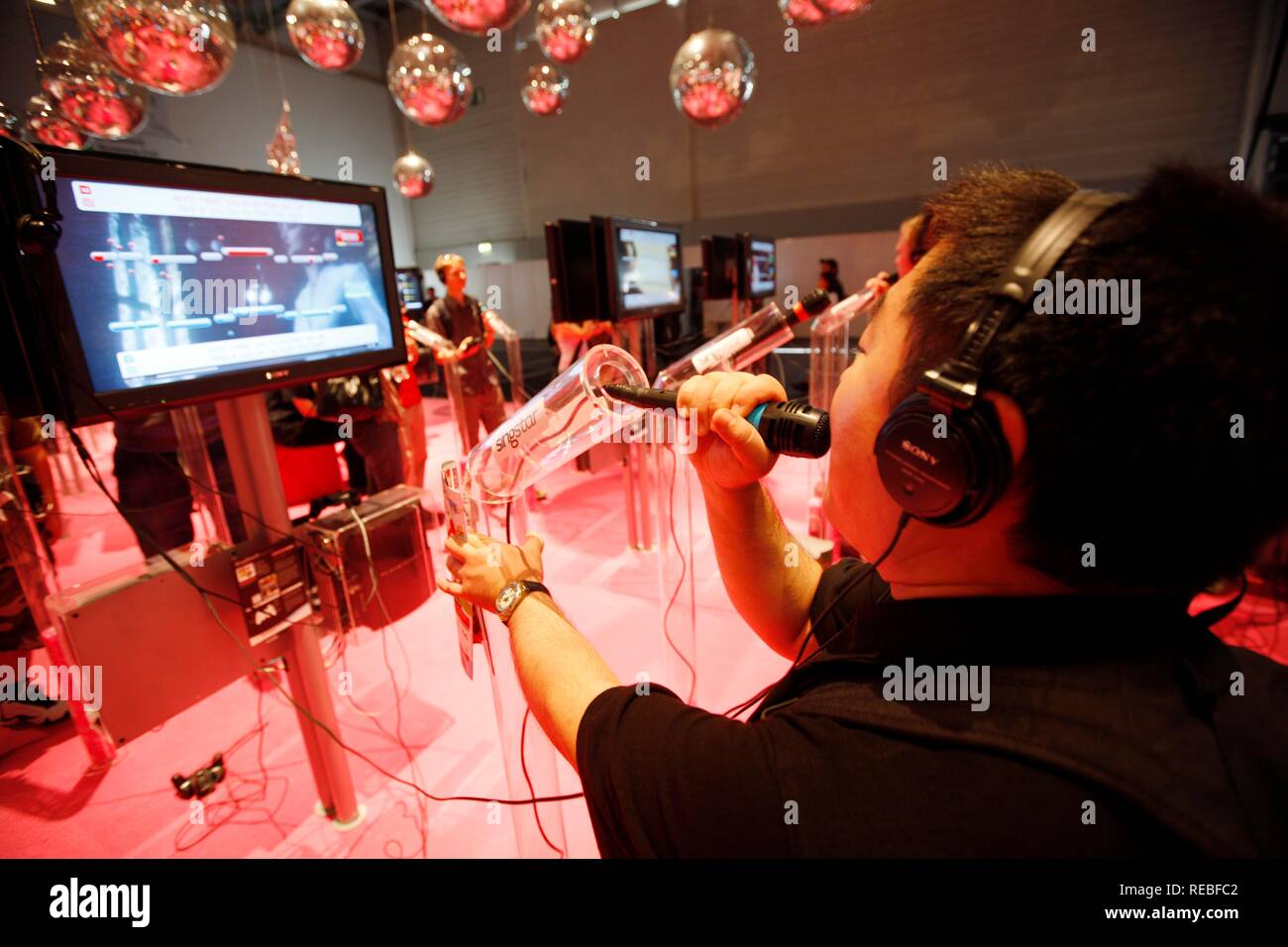 Sony PlayStation Singstar karaoke singing game, stand at the Entertainment Area of the Gamescom, the world's largest fair for Stock Photo