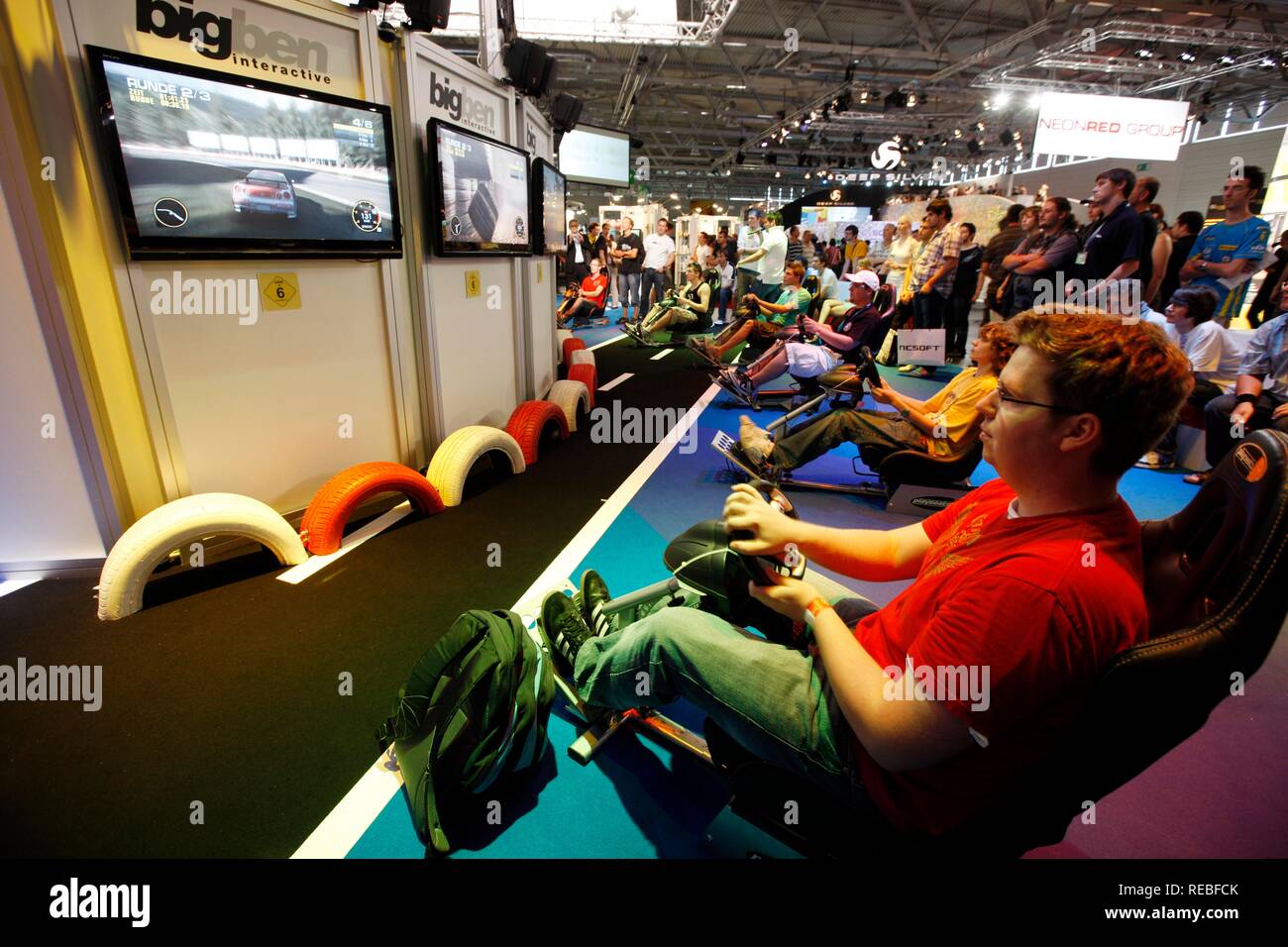 Driving simulator, car racing games, driving games at the Entertainment Area of the Gamescom, the world's largest fair for Stock Photo