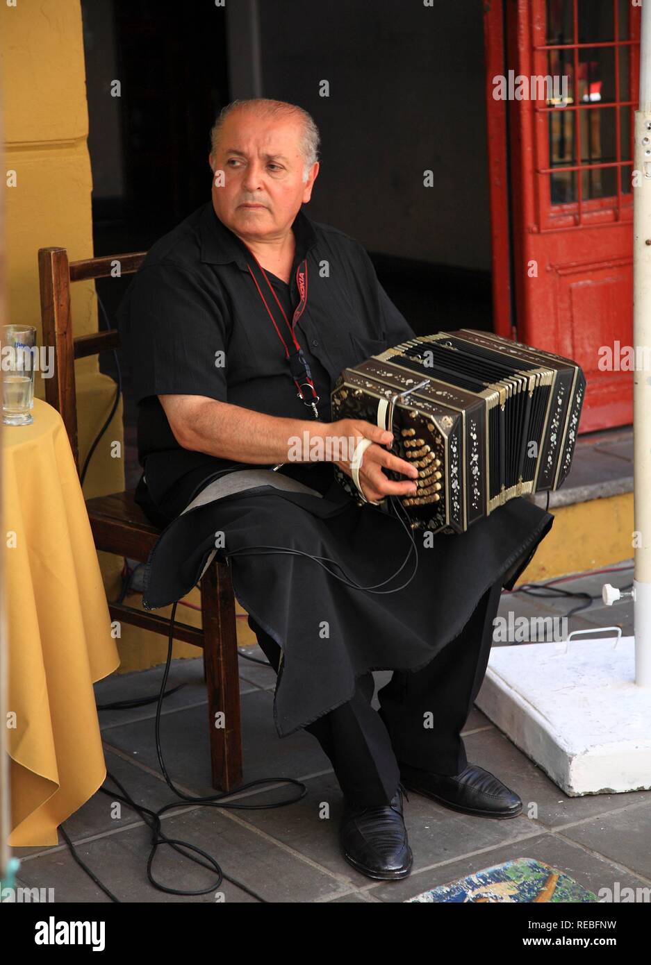 Street musicians, tango musician in Calle Necochea in El Caminito, La Boca district, Buenos Aires, Argentina Stock Photo