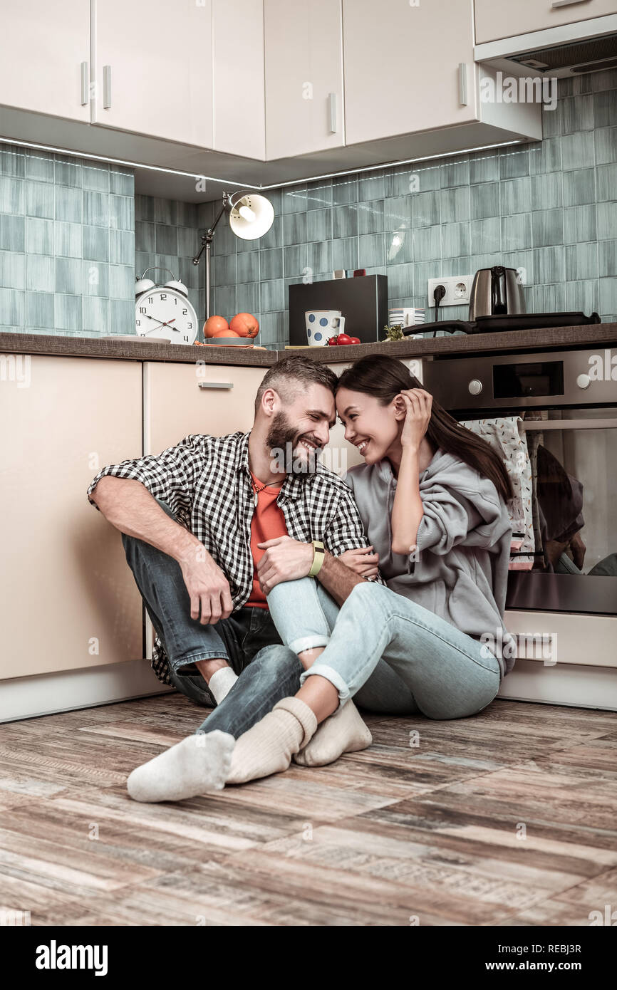 Stylish loving couple wearing jeans feeling happy being together Stock Photo