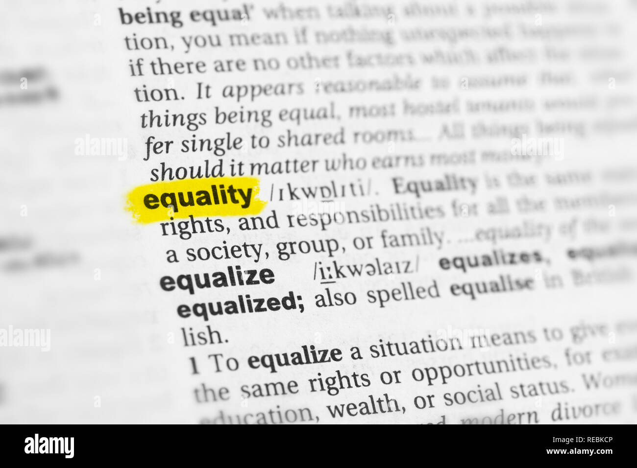 Highlighted English word 'equality' and its definition at the dictionary. Stock Photo