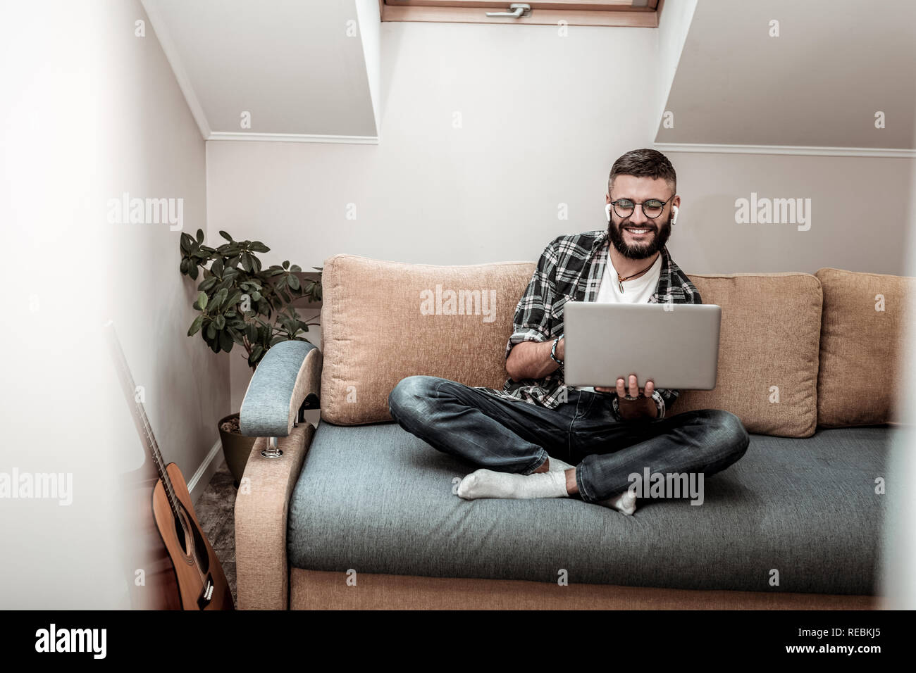 Delighted nice man making a video call Stock Photo
