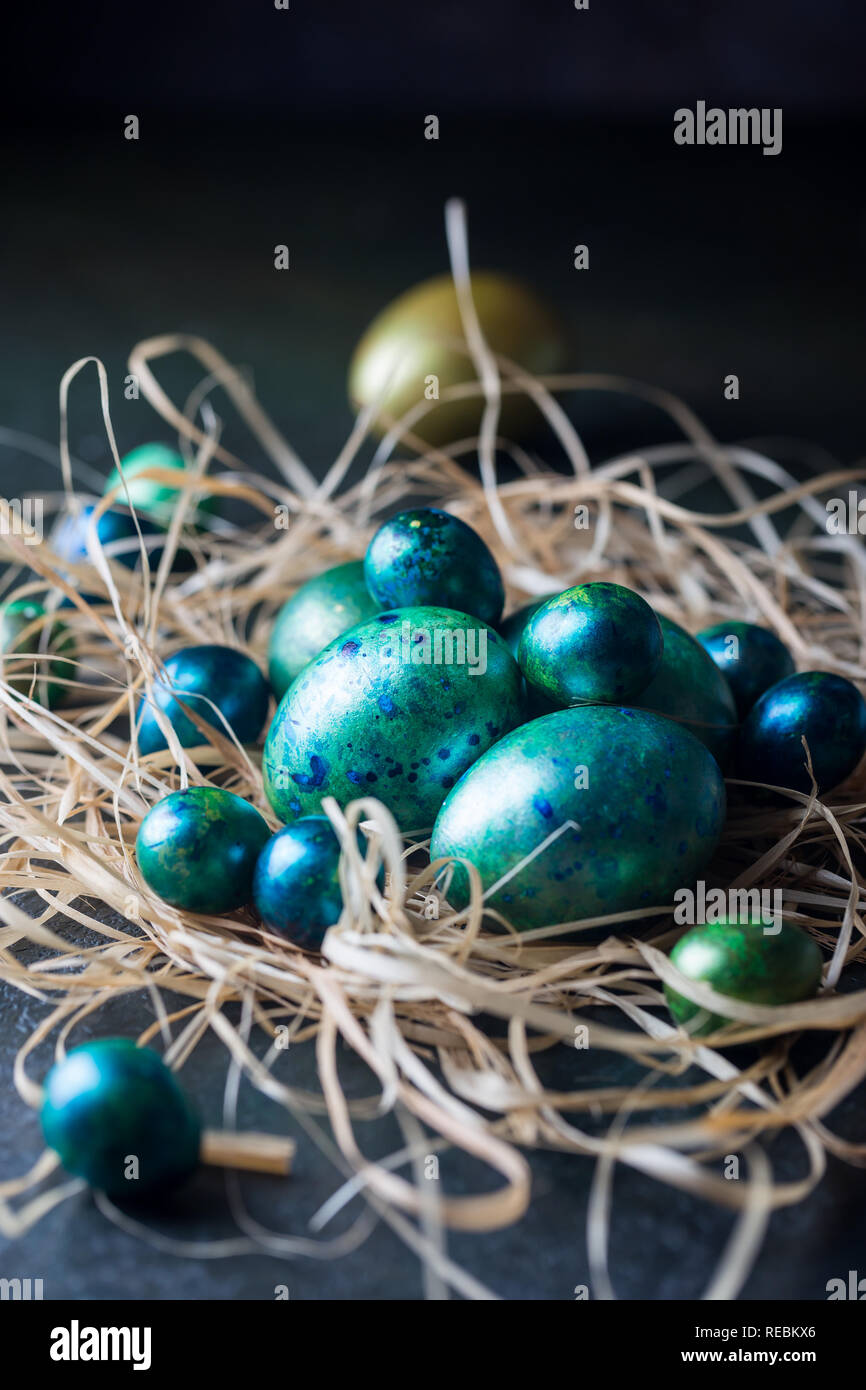 Easter background with painted Easter eggs in vintage style over dark background Stock Photo