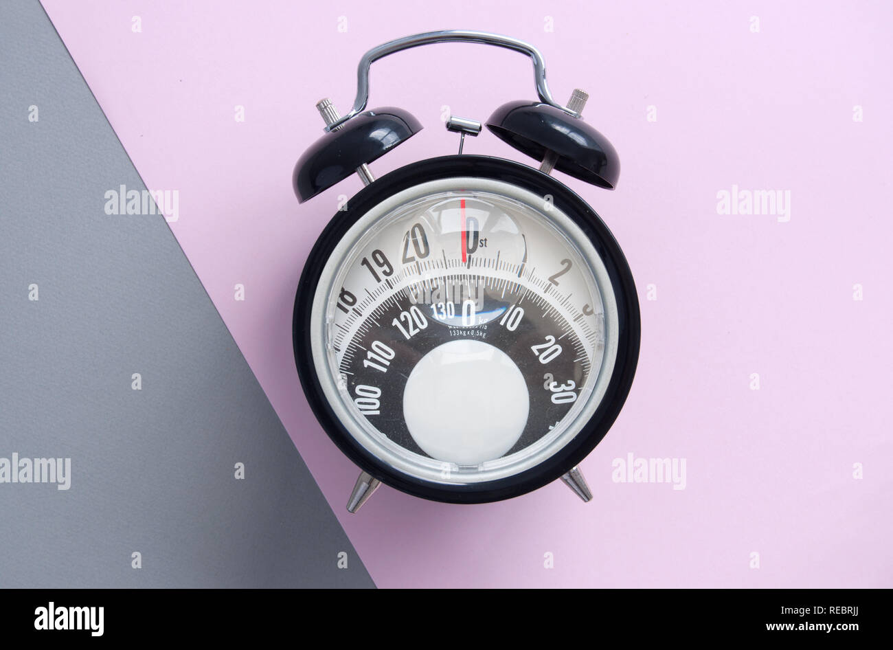 Clock with bathroom scales monitor Stock Photo Alamy