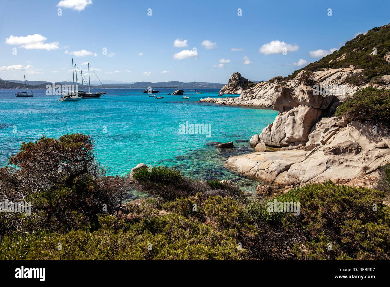 Amazing azure clear sea water with yacht in Sardinia island, Italy. Nature background Stock Photo