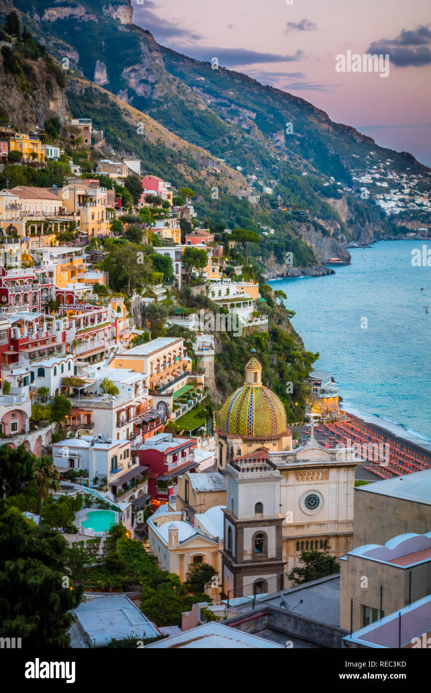 Positano is a village and comune on the Amalfi Coast (Costiera Amalfitana), in Campania, Italy, mainly in an enclave in the hills leading down to the  Stock Photo