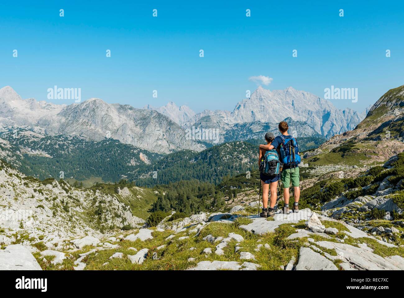 Two hikers looking at the Watzmann, Funtenseetauern, Steinernes Meer, Berchtesgaden National Park, Berchtesgadenener Land Stock Photo