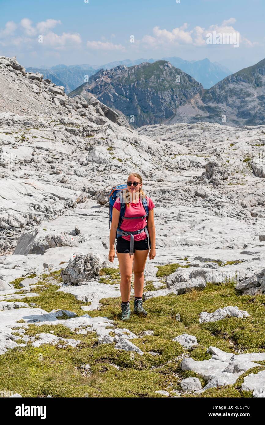 Hiker with rucksack, hiking trail in the Funtenseetauern, Steinernes Meer, Berchtesgaden National Park, Berchtesgadener Land Stock Photo