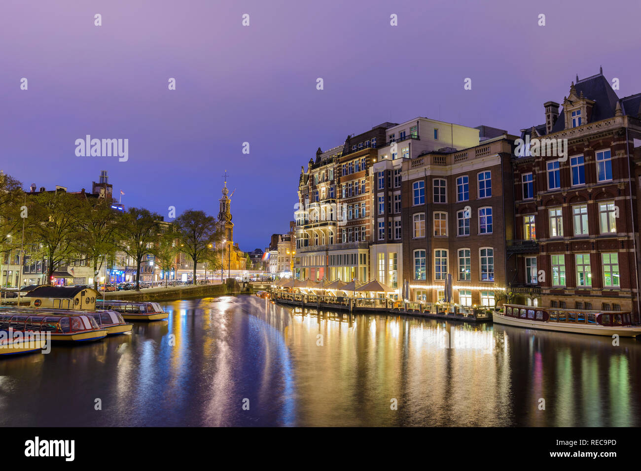 Amsterdam Netherlands, night city skyline at canal waterfront Stock Photo