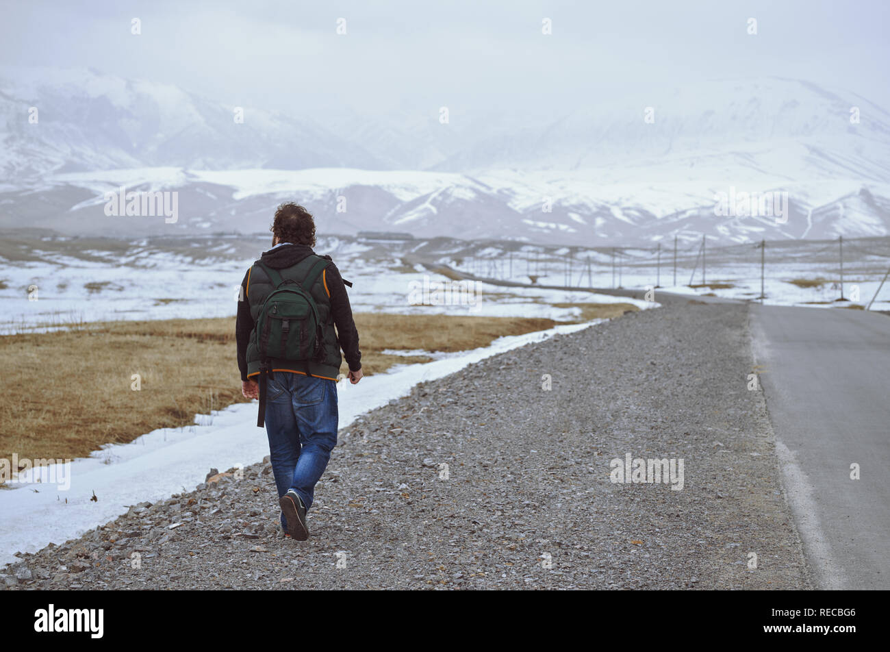 Man walking on winding road hi-res stock photography and images - Alamy