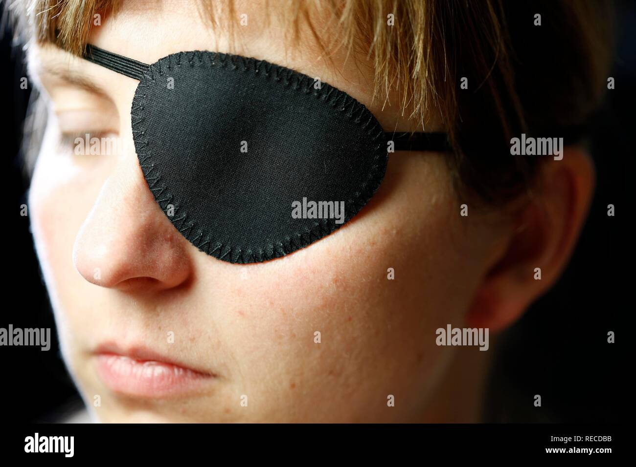 Young woman wearing a black eye patch Stock Photo