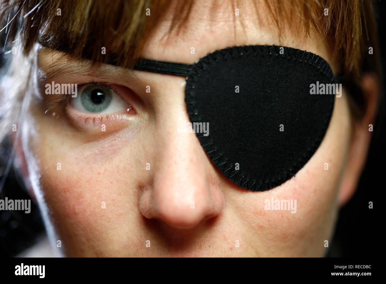 Young woman wearing a black eye patch Stock Photo