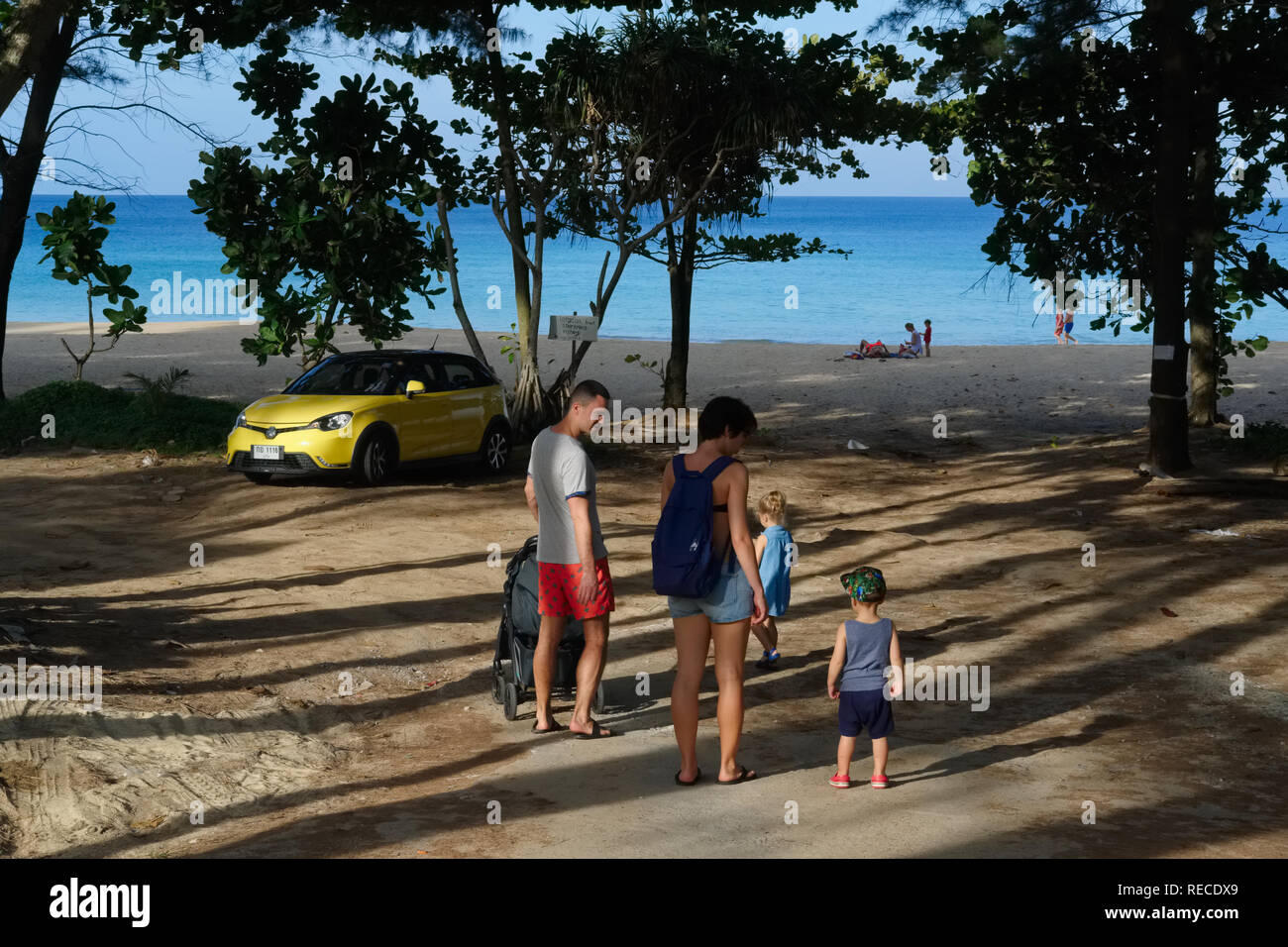 A family of four, tourists at Nai Thon Beach, Phuket, Thailand Stock Photo