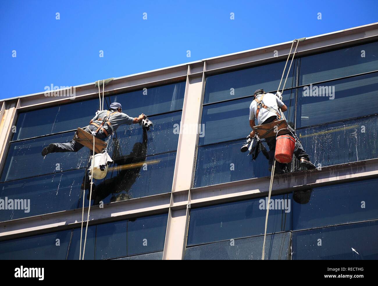 Window cleaners on a skyscraper in Buenos Aires, Argentina, South America Stock Photo